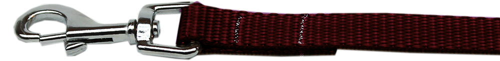 Brown dog leash with metal clip on a white background