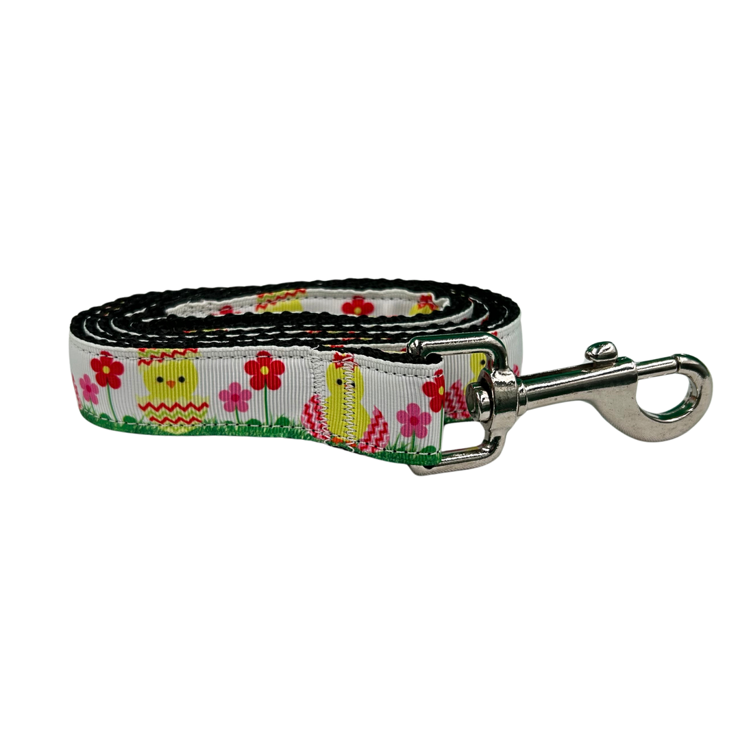 Dog leash with Easter-themed design featuring chicks and flowers on a white background