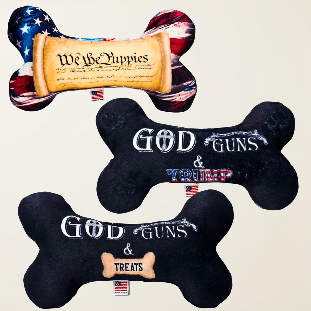 Three Bone shapes toys. One has an American flag background with an image of the constitution scroll with text saying We The Puppies. Two has a black background with text that says God, Guns & Trump. Three has a black background with text that says God, Guns & Treats.